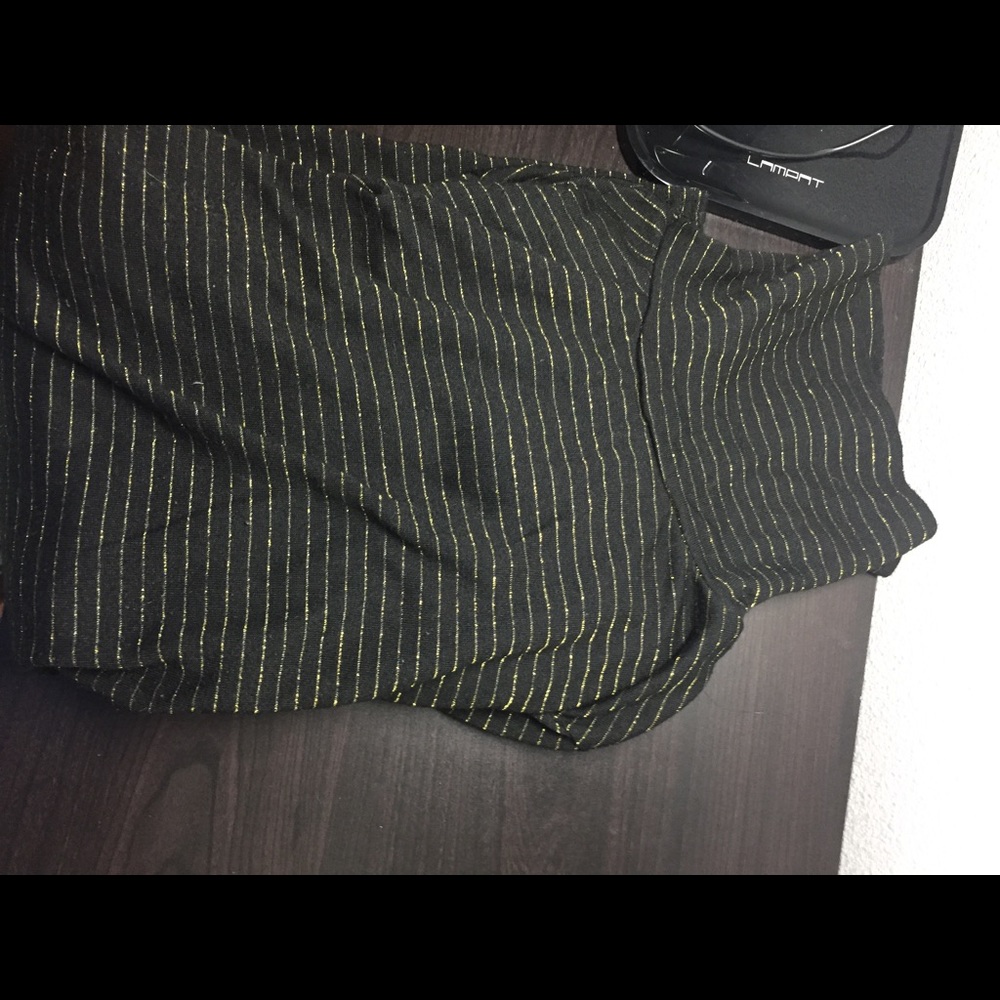Black turtleneck with gold stripes